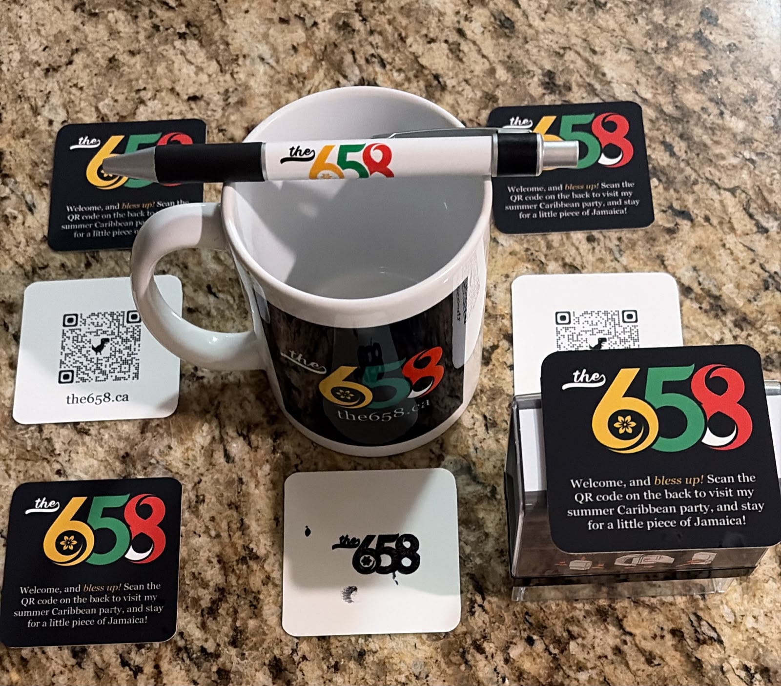 Promotional merchandise for the 658 including mug, pen, coasters and cards